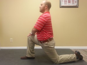 Hip flexor stretch demonstrated by Dr. Curtis
