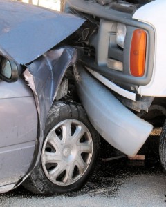 car accident, a white truck smashed up into the hood of a silver sedan