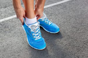 Person tying shoelaces